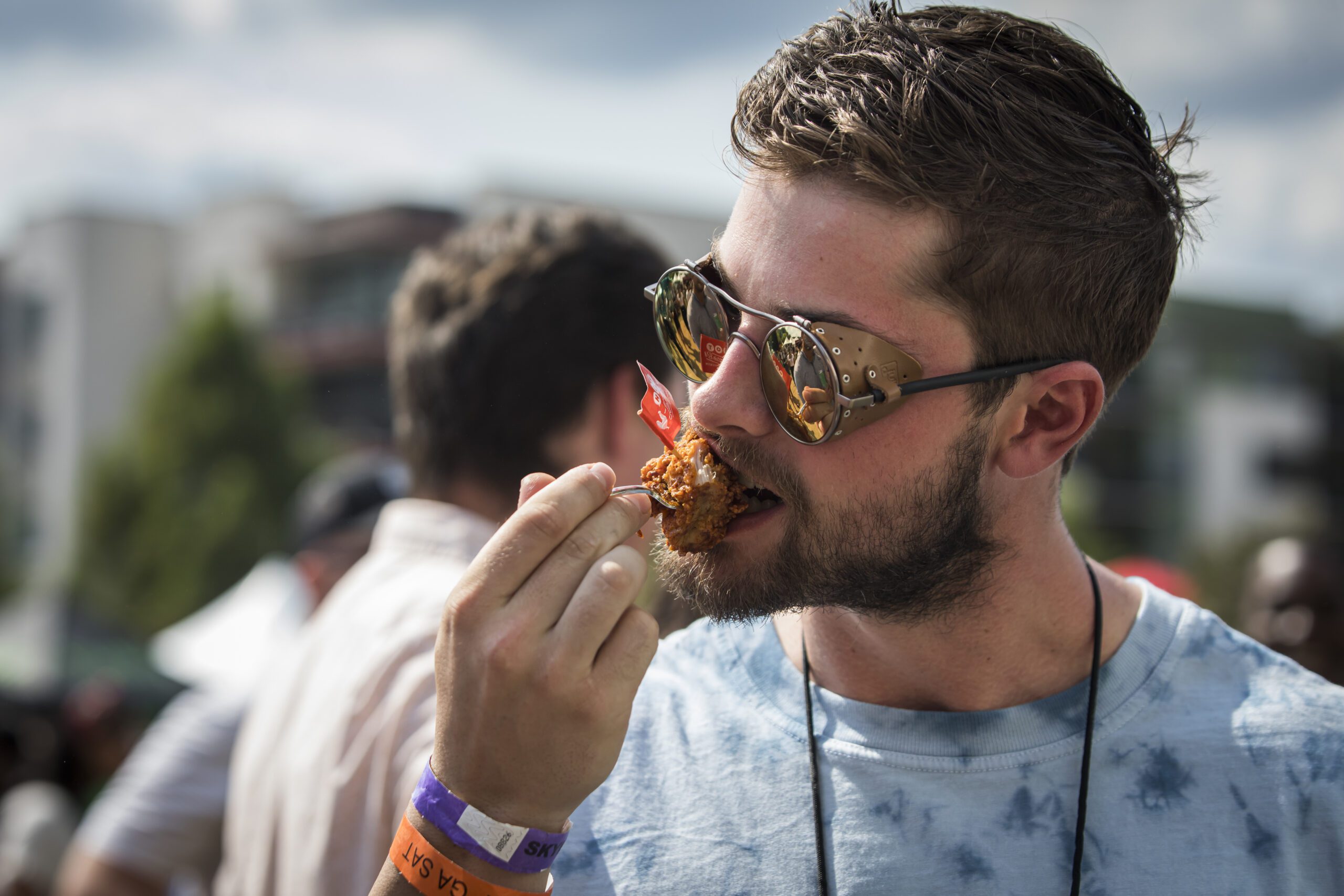 person tasting food at Atlanta Food & Wine Festival