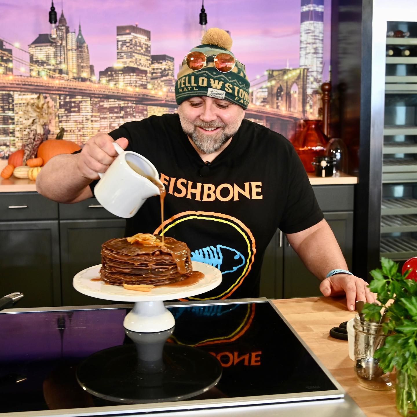 chef dressing pancake at a21 culinary event