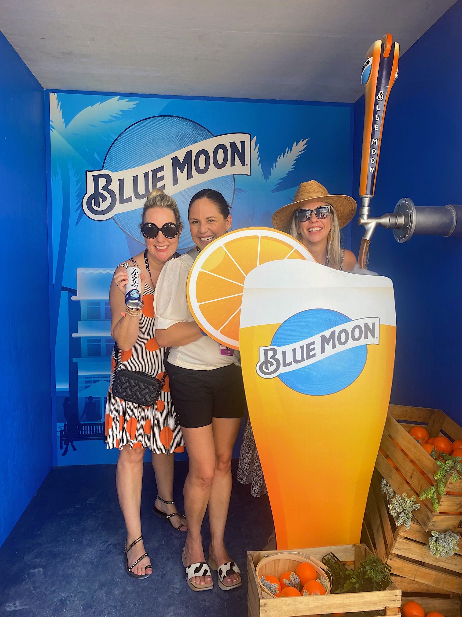 people smiling at blue moon stand